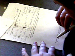 Student writes on worksheet