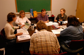 teachers sitting at a conference around a table